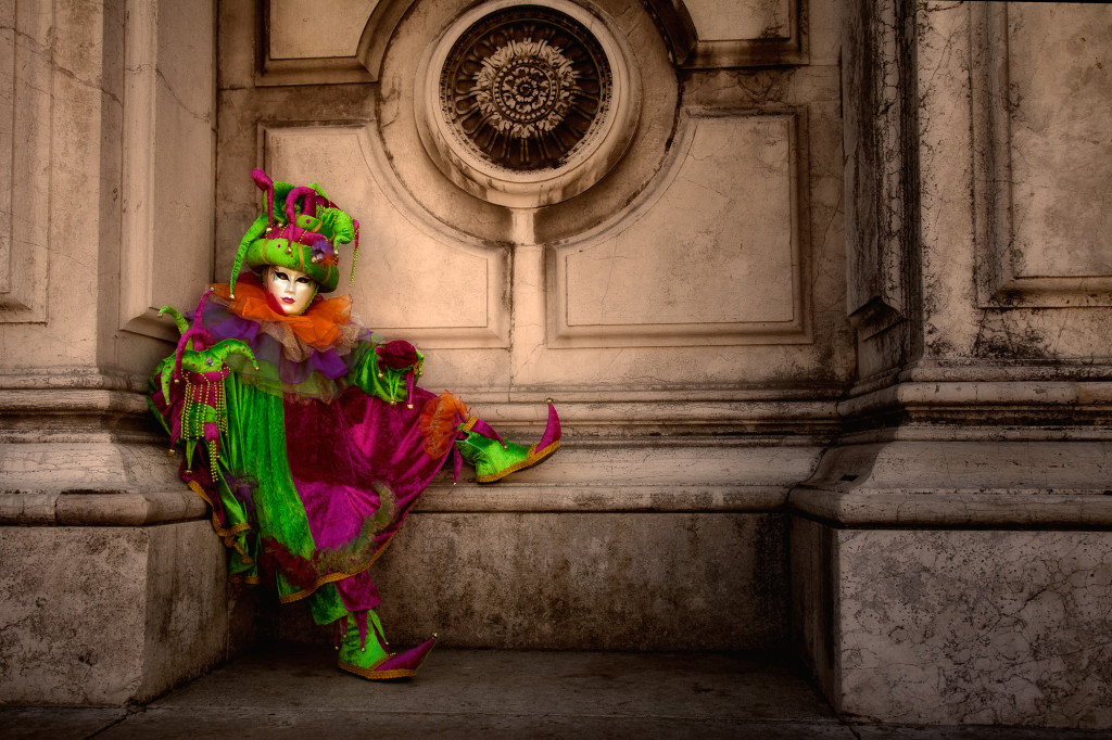 Carnival costumed model sitting outside San Gorgio church