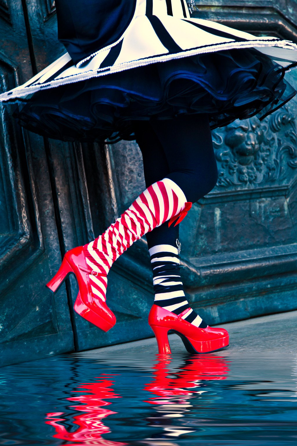 Bright red shoes and striped socks at Carnival in Venice