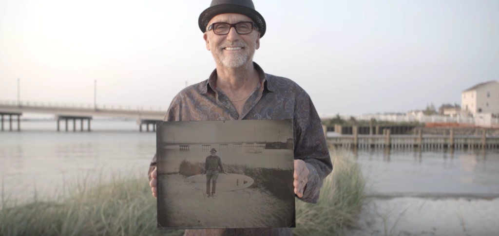 Greg "Grog" Mesanko poses while holding his Wet Plate portrait captured by Matt Alberts. 