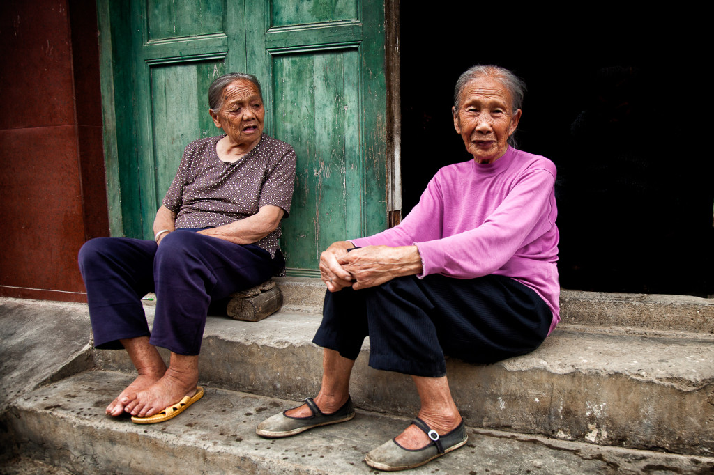 Older Chinese women sitting on the stairs. Although I took this image in 2012, I was back in 2015 and found the same women, sitting on the same stairs, and wearing the same clothes.