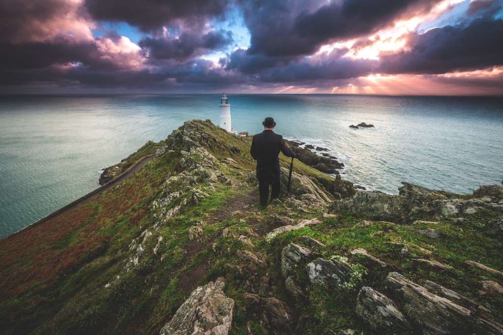 So The Bowler Man has finally reached image 100. To celebrate this milestone he thought he would show you a picture outside of London. Here he is on holiday in South Devon, United Kingdom with the beautiful views you get from Start Point Lighthouse.