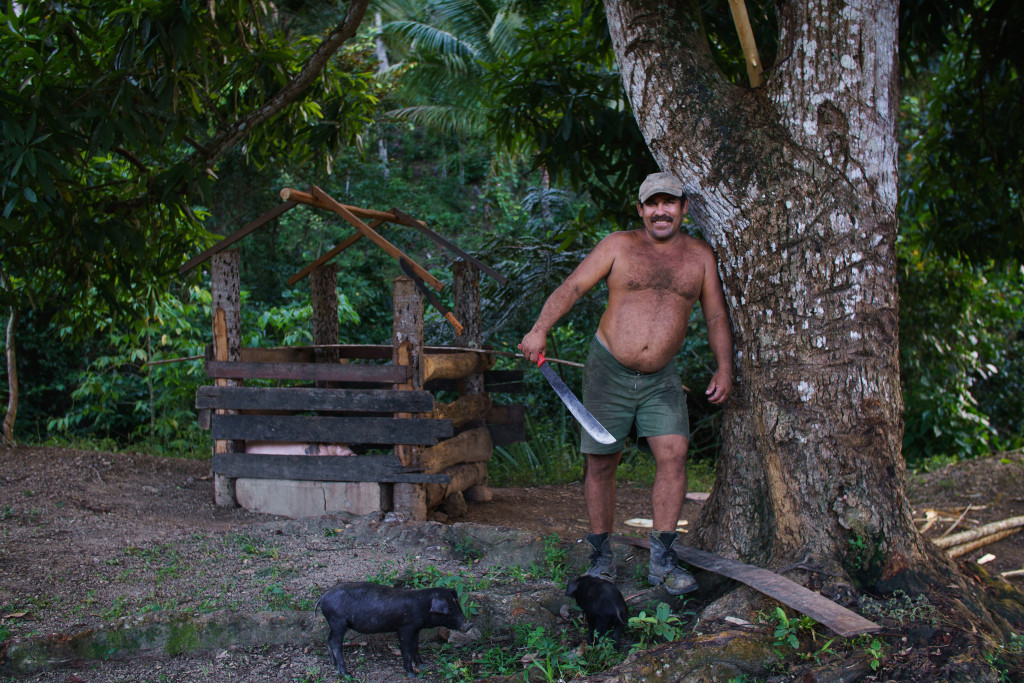 Armando, otherwise known as the Cuban Chuck Norris, poses for a portrait in his backyard in the hills surrounding Baracoa. As a cacao farmer, Armando is never apart from his trusty machete, which is the same with most Cuban men in the east. Photographed with a Tamron 35mm f/1.8 at 1/80 and f/2.5.