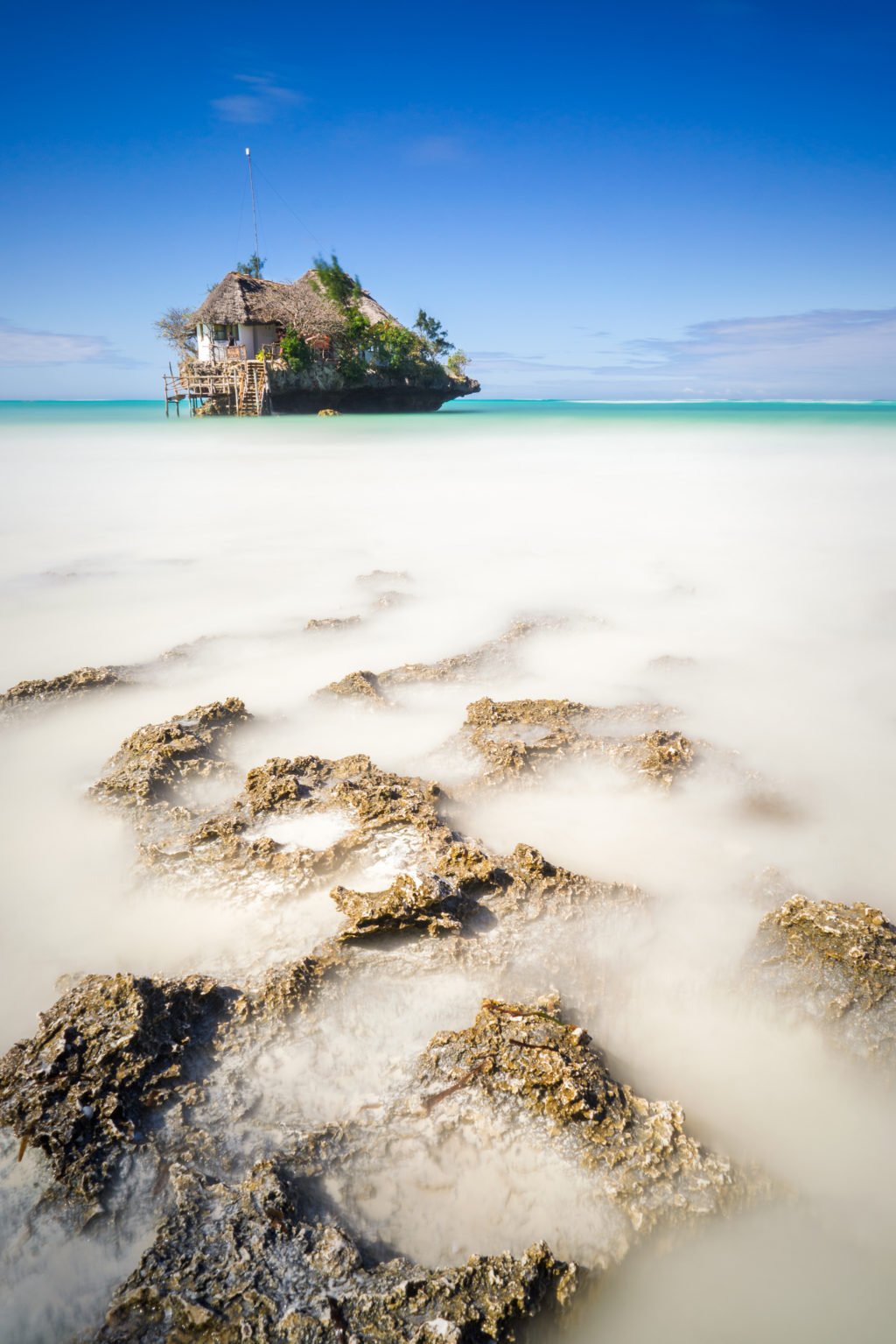 The Rock. One of the most iconic views of Zanzibar. It is a restaurant that was built on a rock not too far from the shore of Pingwe on the east coast. Although you can get to the rock on foot at low tide, you’ll need a boat if you want to reach your table at high tide!