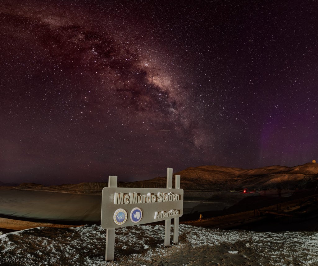 May 4th 2016 This was a tough shot for me as the sign is in McMurdo station and town lights are all around accept directly in front which helped. This is a mosiac panoramic as well from 20 exposures.