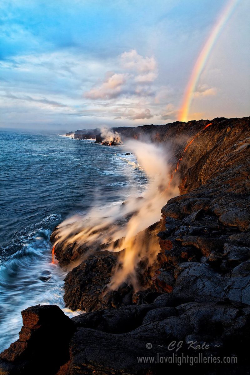 A rainbow appears over the lava filled coastline of Hawaiʻi Volcanoes National Park on the Big Island of Hawaii. Photo by CJ Kale. 