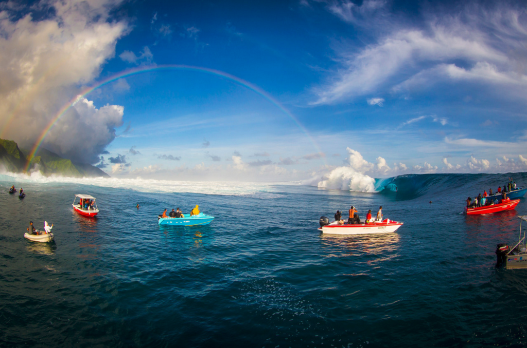 A rainbow over the frequented surfed breaks in Tahiti. Photo by Ben Thouard. 