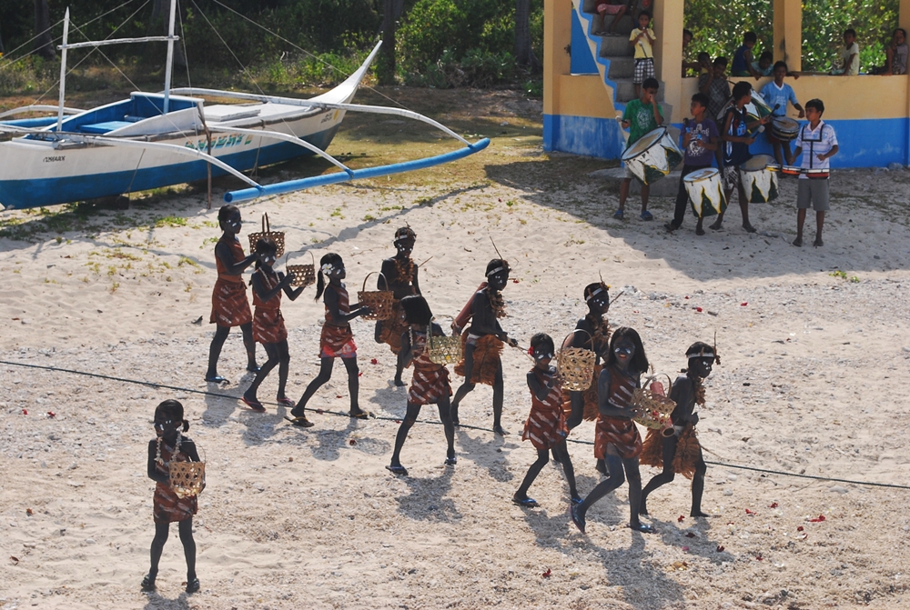 and experience local island culture such as this festival held at Cobrador Island in Romblon © nomadicexperiences.com